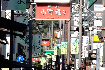 買う